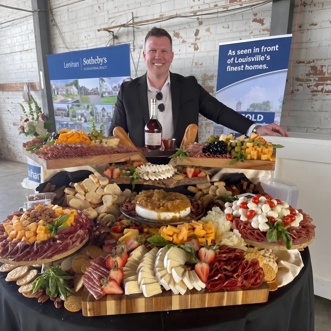 Catered event table with food and cocktails
