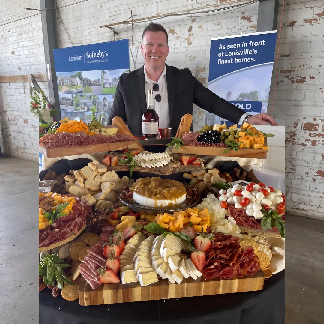 Caterer arranging a charcuterie board and cocktails
