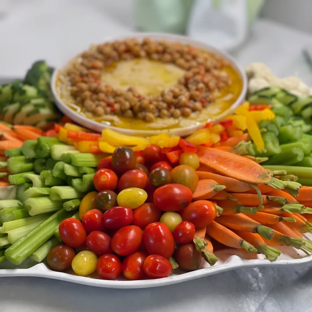 Assorted catered sandwiches, pastries, and fruit arranged for an event