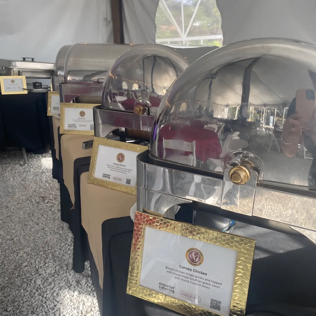 Catered buffet with salads, sandwiches, and shared sides