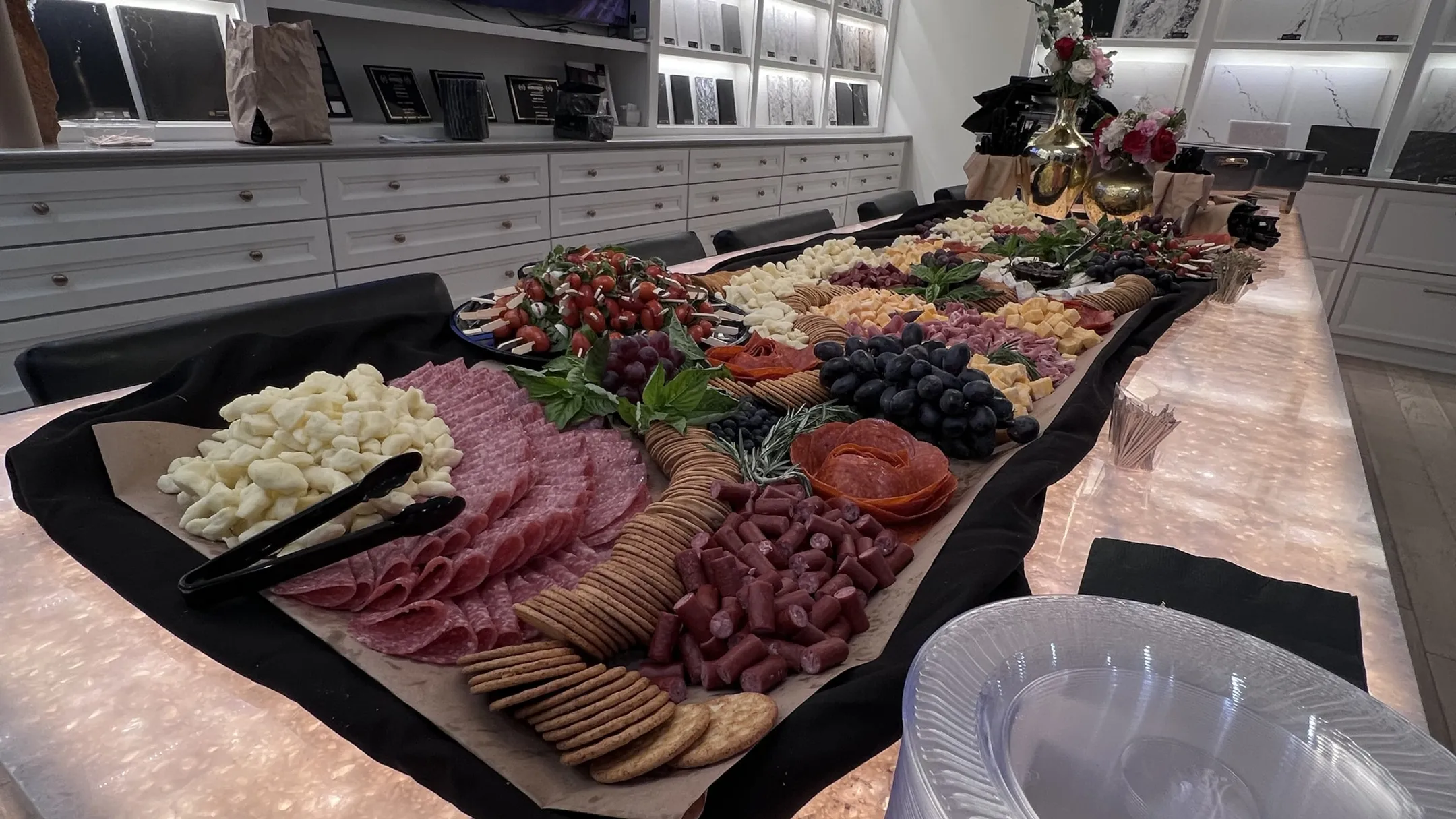 Professional BBQ buffet station with chafing dishes warming trays and organized food service setup