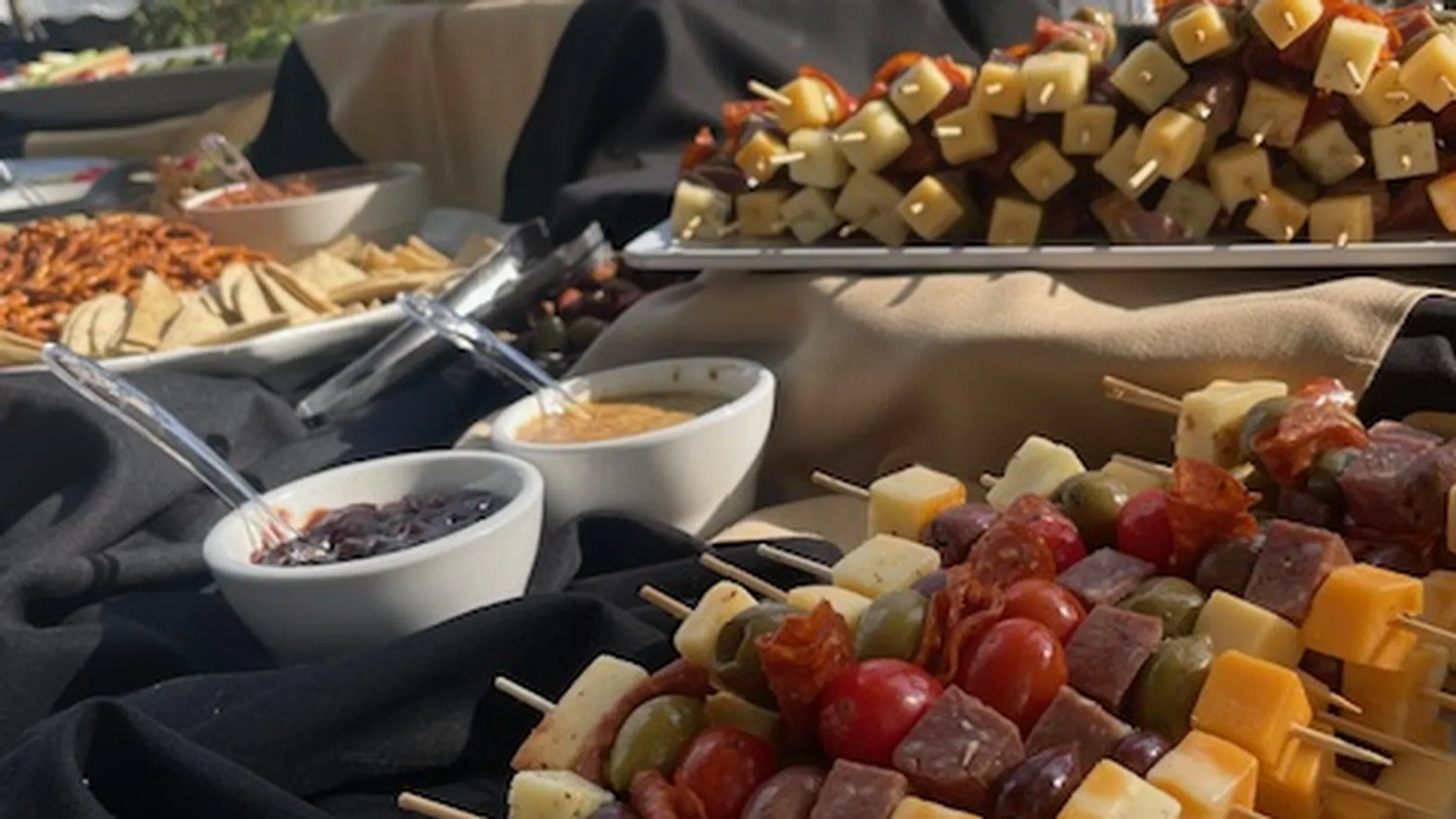 Professionally arranged charcuterie board showing proper spacing texture variety and visual balance