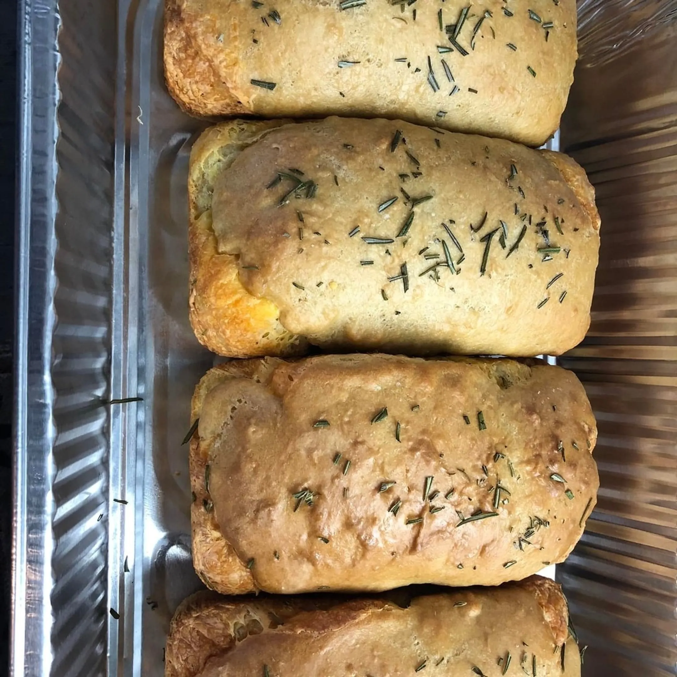 Catered buffet with salads, sandwiches, and shared sides