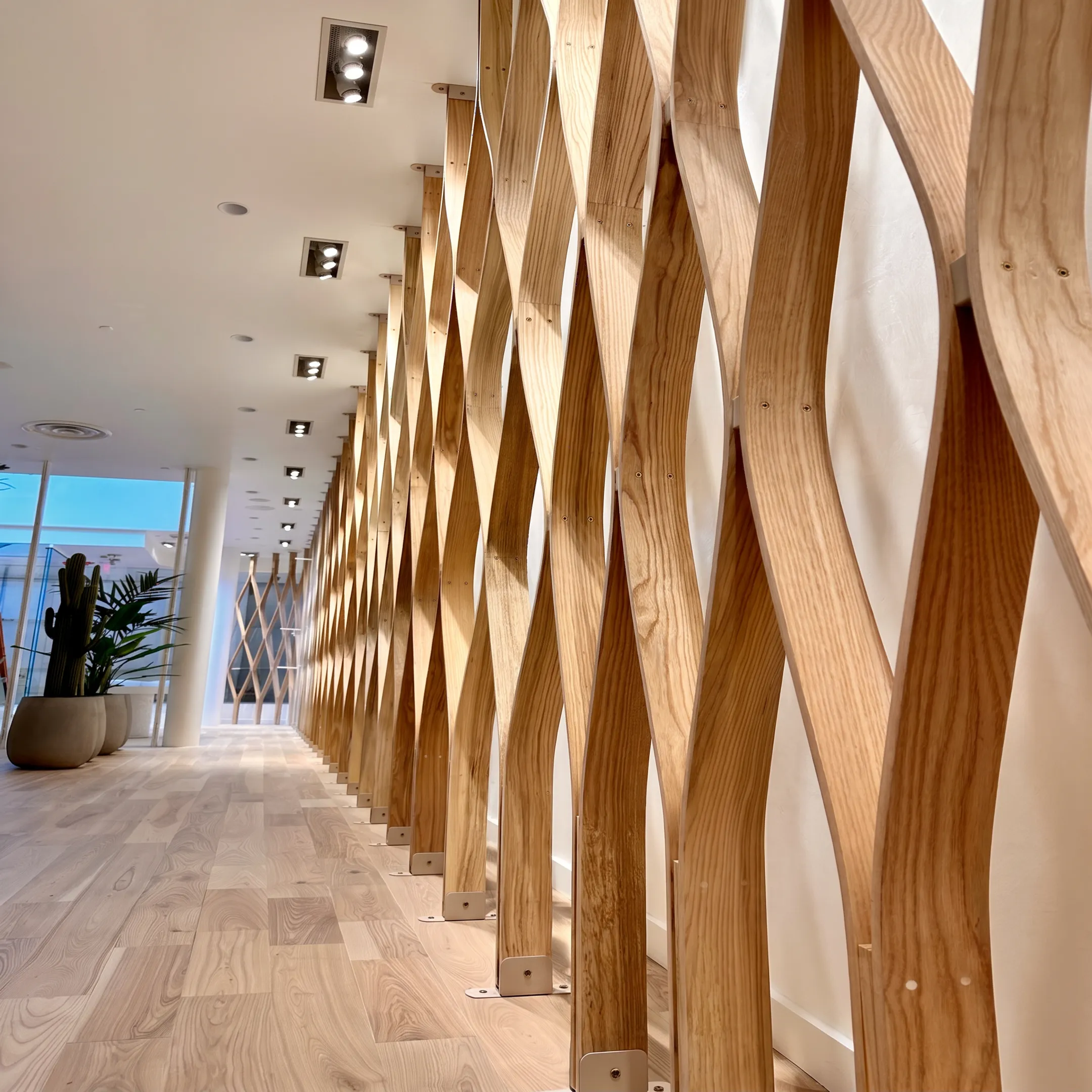 Custom architectural millwork and wood display fixtures in a modern retail store