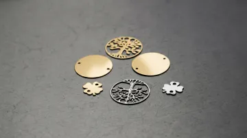 Fiber laser cutting precision jewelry components in gold and silver sheet metal