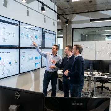 Enterprise data engineering team reviewing cloud data architecture
