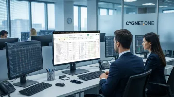Bank operations team reviewing automated reconciliation results on multiple monitors