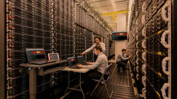 IT team executing disaster recovery failover simulation in data center environment