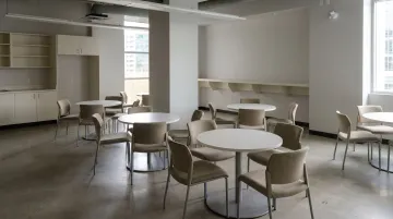 Empty office break room with no food access showing workers without on-site amenities
