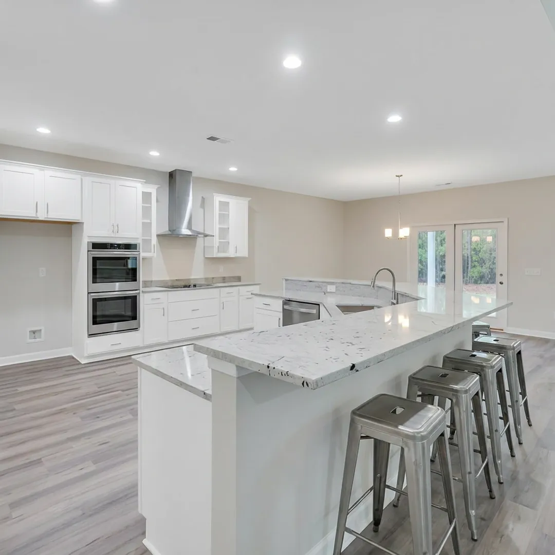 Bright new construction home kitchen and living area