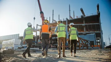 Construction crew on commercial job site representing labor cost escalation pressures
