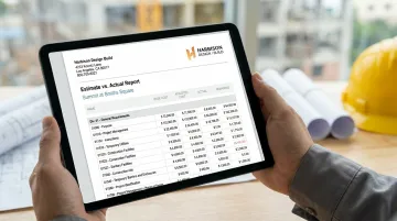 Construction finance professional accessing WIP report data on mobile device at job site