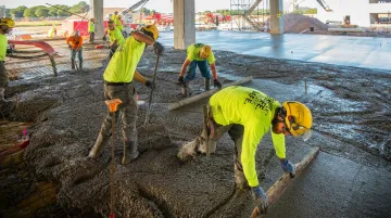 Construction crew working on job site with labor productivity tracking and time management