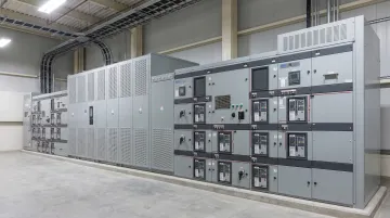 Industrial low-voltage switchgear lineup with arc-flash mitigation components installed in facility