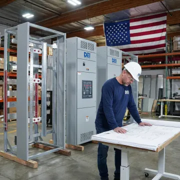 Engineer reviewing commercial electrical equipment plans