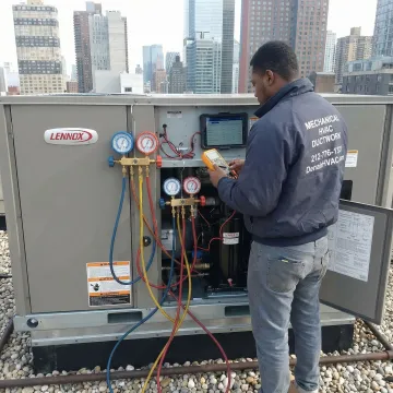 HVAC technician performing step-by-step diagnostic repair on a Lennox rooftop unit