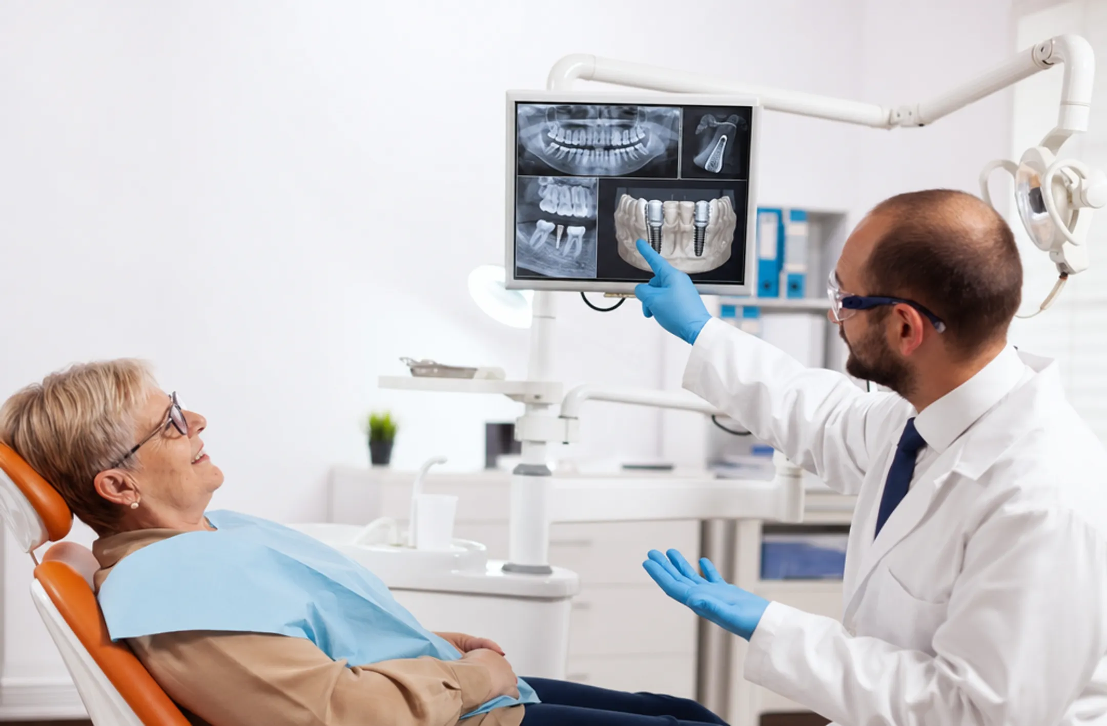 Dental clinic consultation showing implant brand transparency and treatment planning