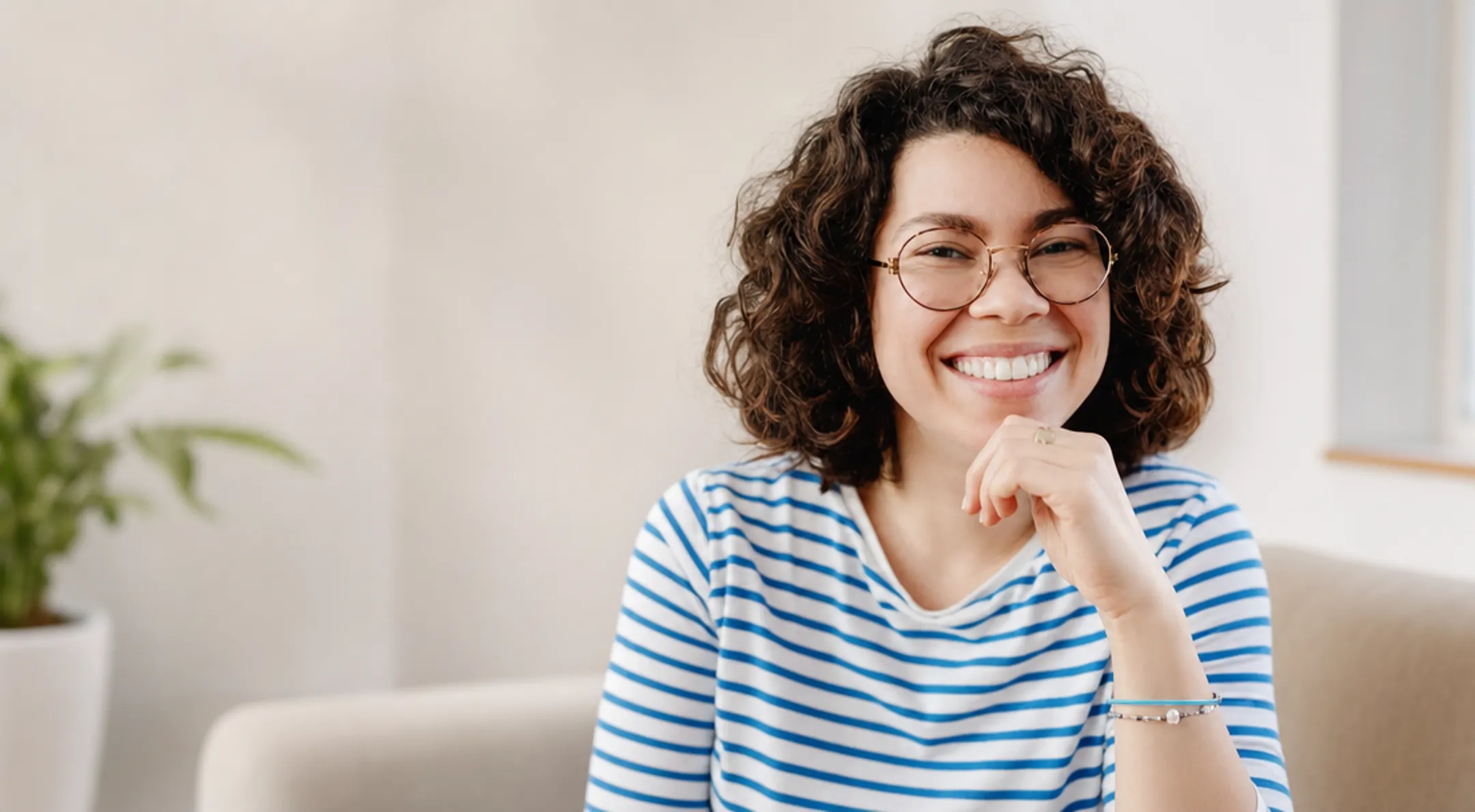 Patient smiling confidently after full-arch dental implant recovery