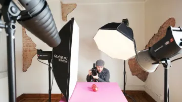 Professional food photography studio lighting setup with softboxes and product on set