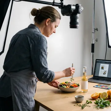 Food stylist preparing a product photography shoot