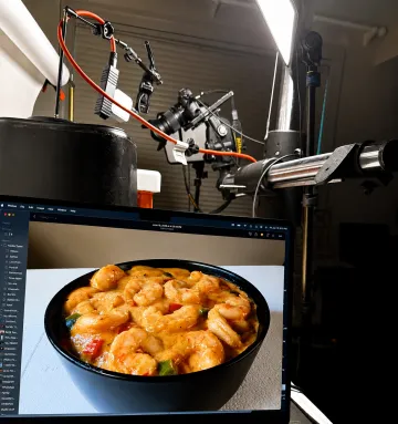 Food stylist preparing a studio photo shoot