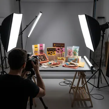 Food photographer styling sweets in studio