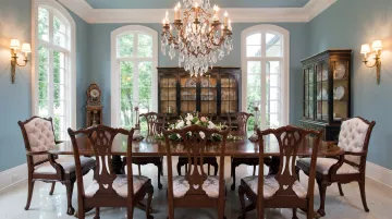 Traditional luxury dining room with mahogany table and crystal chandelier