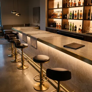 Modern bar counter with sleek surface and warm lighting