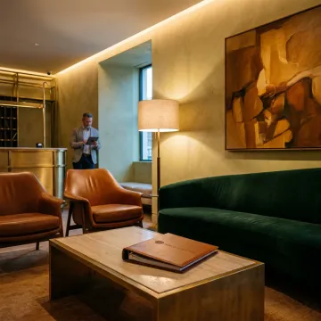 Boutique hotel lobby with custom furniture and warm lighting