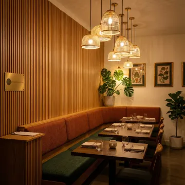 Elegant Thai restaurant interior with warm lighting and custom seating