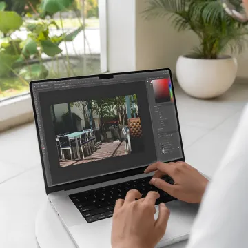Designer reviewing residential floor plans and material samples