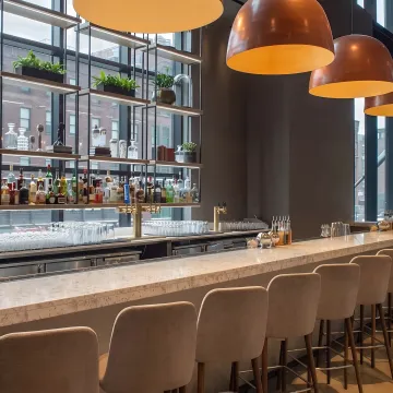 Upscale custom bar interior with designer lighting