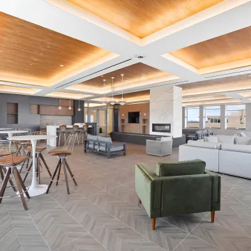 Designer reviewing commercial interior plans and finishes