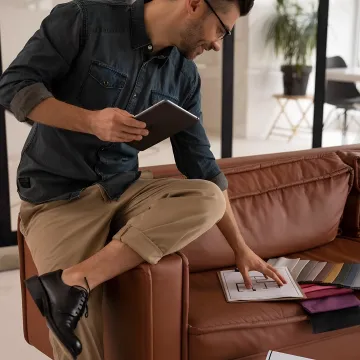 Designer reviewing luxury home plans and finishes