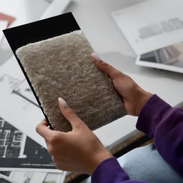 Interior designer reviewing renderings and material samples