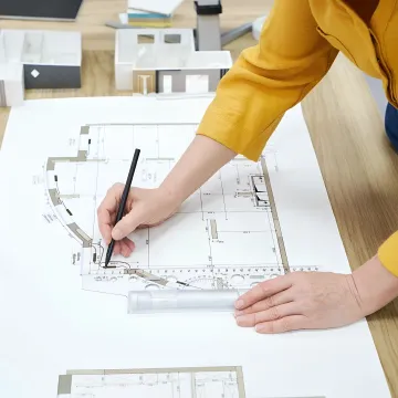 Interior designer reviewing plans and finishes