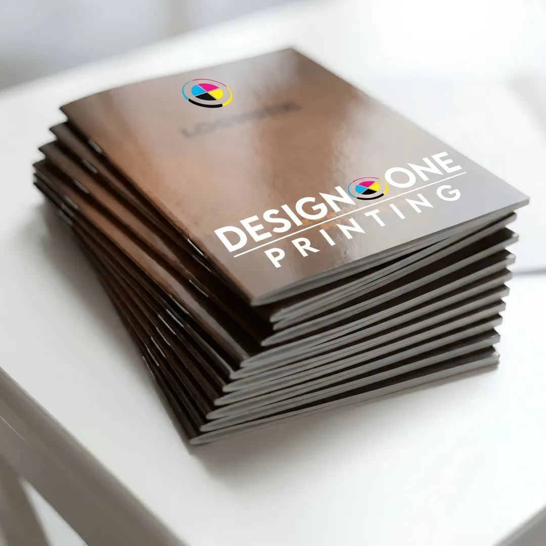 Printed saddle stitch catalogs on table