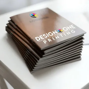 Printed saddle stitch catalogs on table