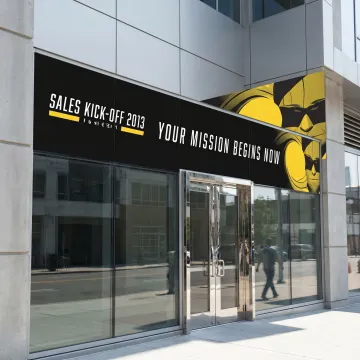 Large adhesive vinyl graphics installed on a storefront window