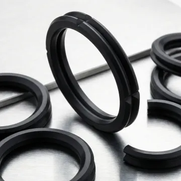 X-ring and quad ring seals arranged on a technical surface showing four-lobed cross-section profile