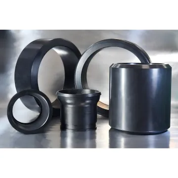 Precision packer elements and oilfield well intervention seals on an industrial workbench