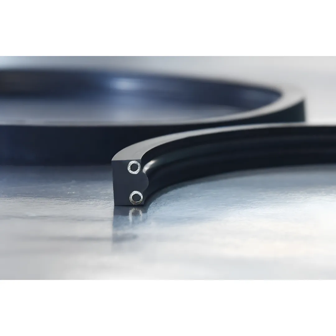 Custom rubber seals and gaskets arranged on an industrial workbench in a manufacturing facility