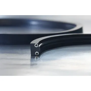 Custom rubber seals and gaskets arranged on an industrial workbench in a manufacturing facility