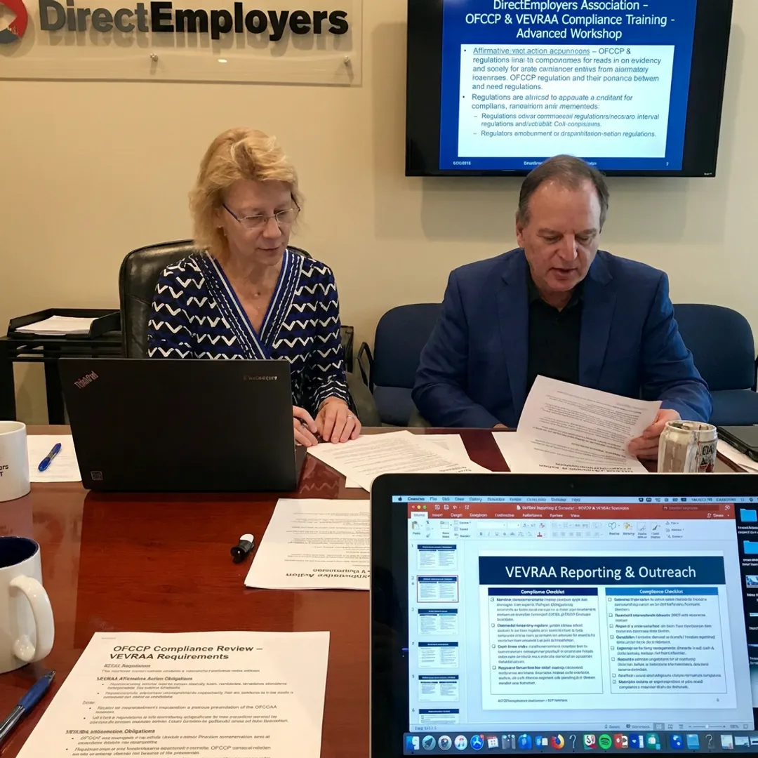HR team reviewing OFCCP compliance training materials