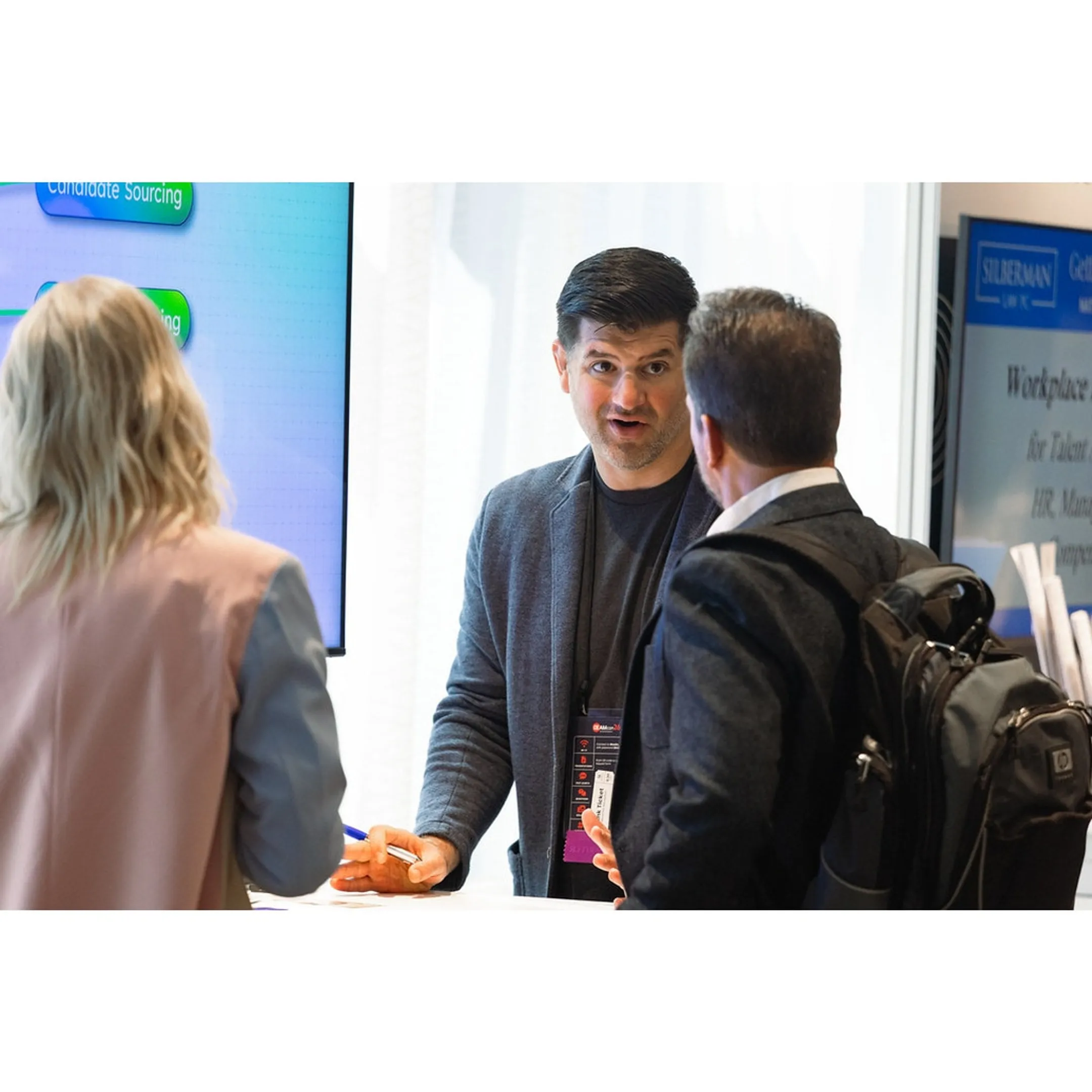 Attendees networking at the DEAMcon conference