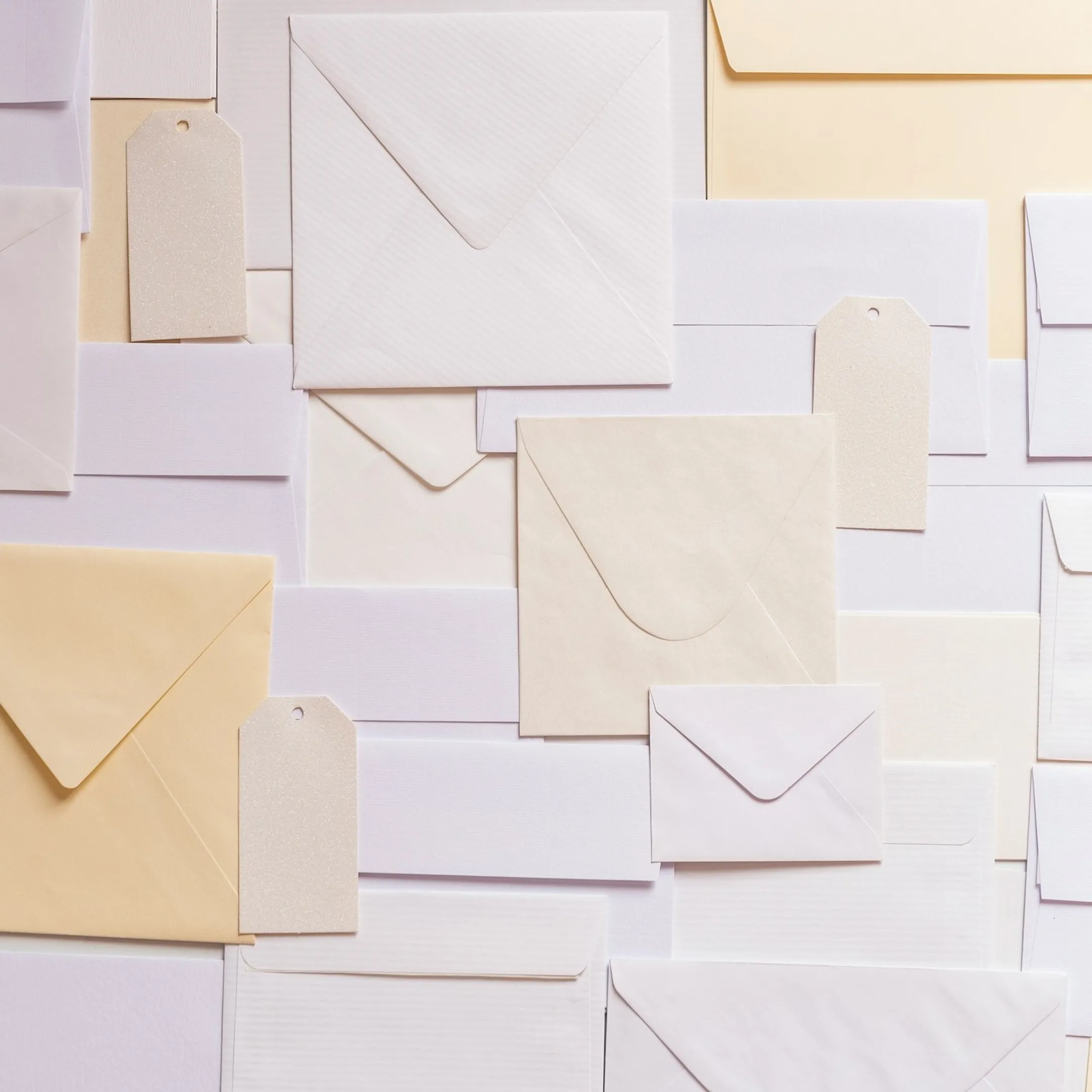 Organized stack of printed mailers prepared with postal barcodes and indicia for delivery