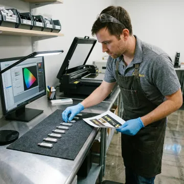 Technician preparing branded USB flash drives for distribution