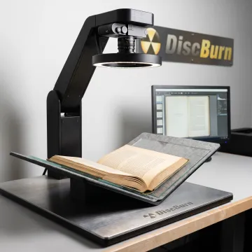 Open book being digitized with overhead scanner