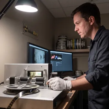 Film reel being digitized in a studio