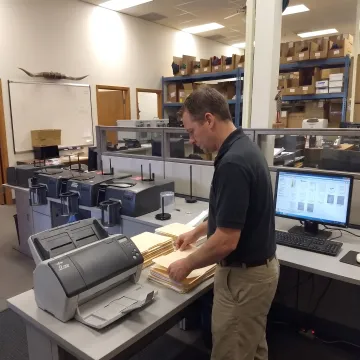 Technician organizing digitized document files